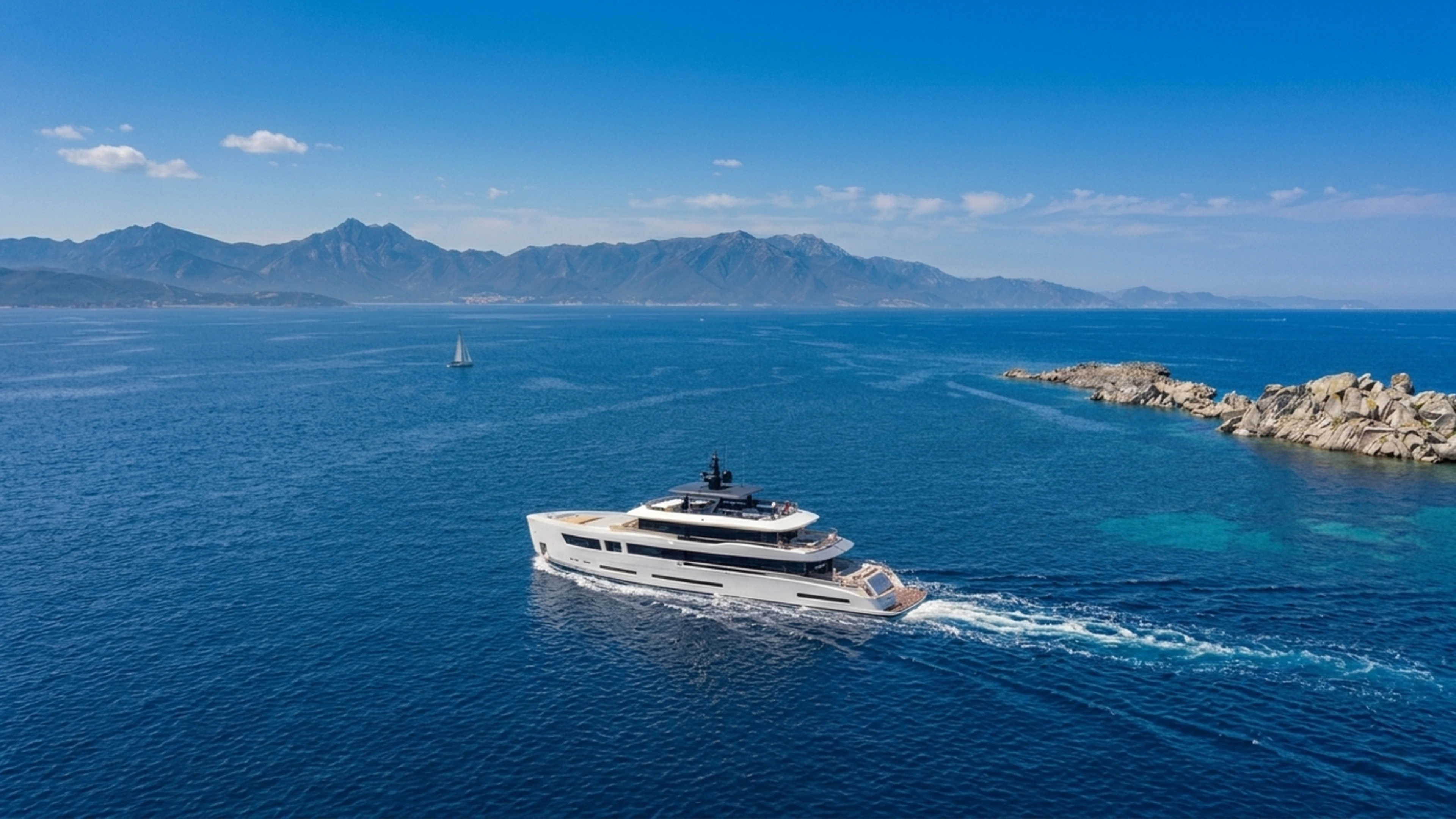 A large superyacht underway on open water