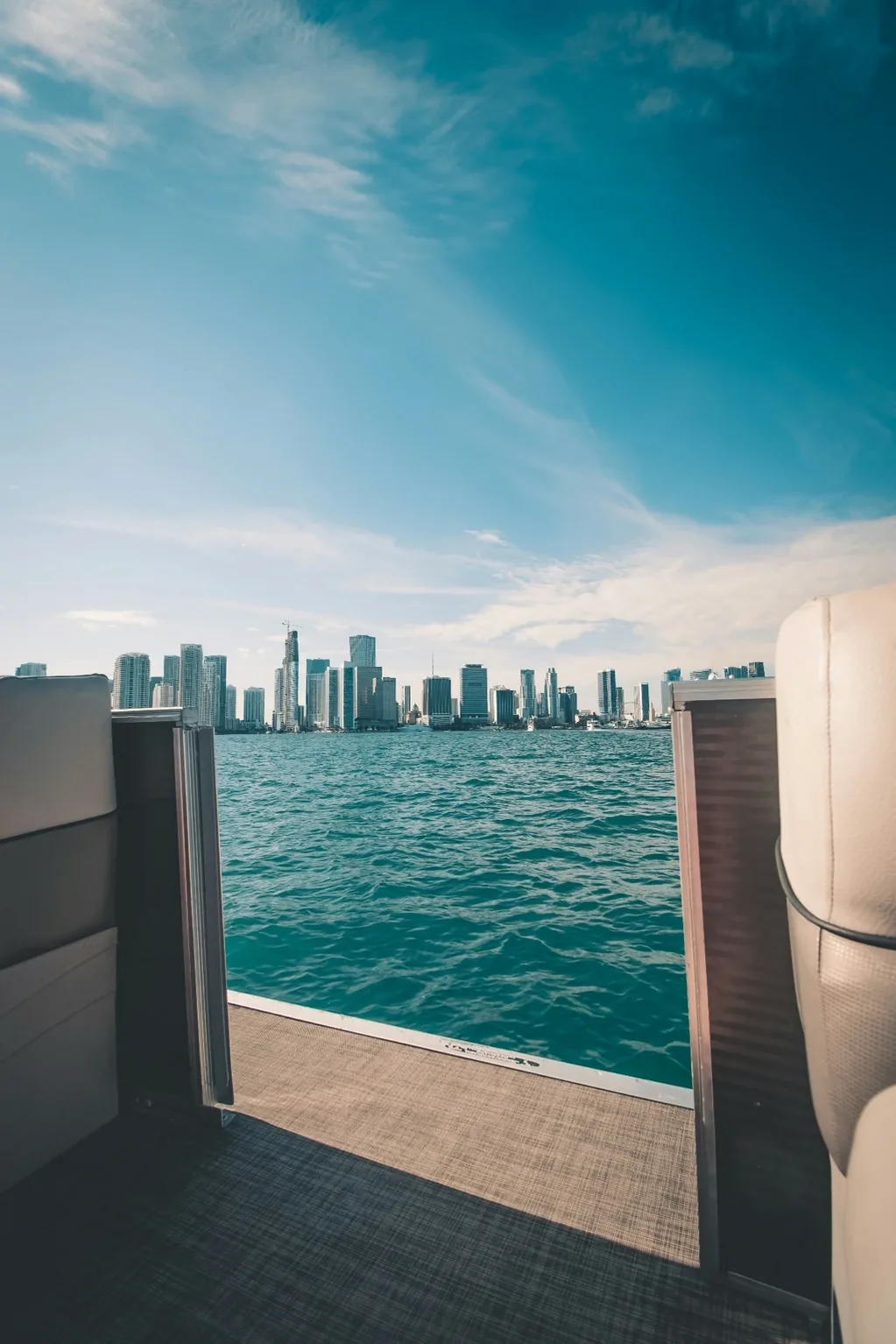 A yacht on the water against the Miami skyline